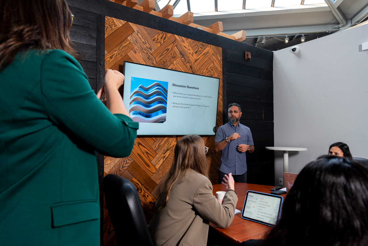 Using sign language in a boardroom meeting